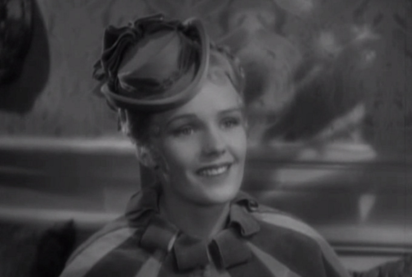 Screenshot of Josie Mansfield (Frances Farmer) smiling - from The Toast of New York (1937)