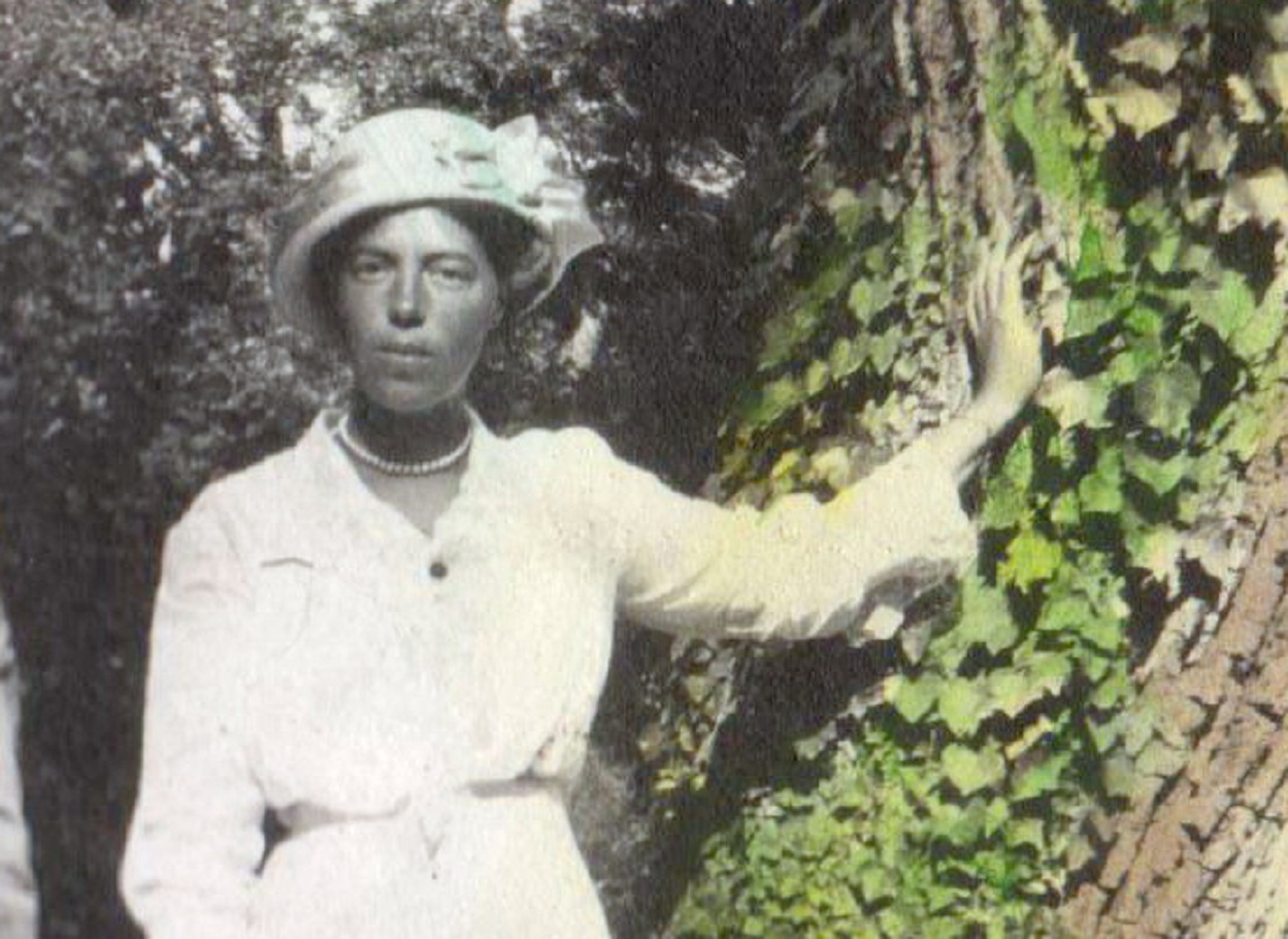 Grand Duchess Olga Alexandrovna standing in white outside - circa 1913