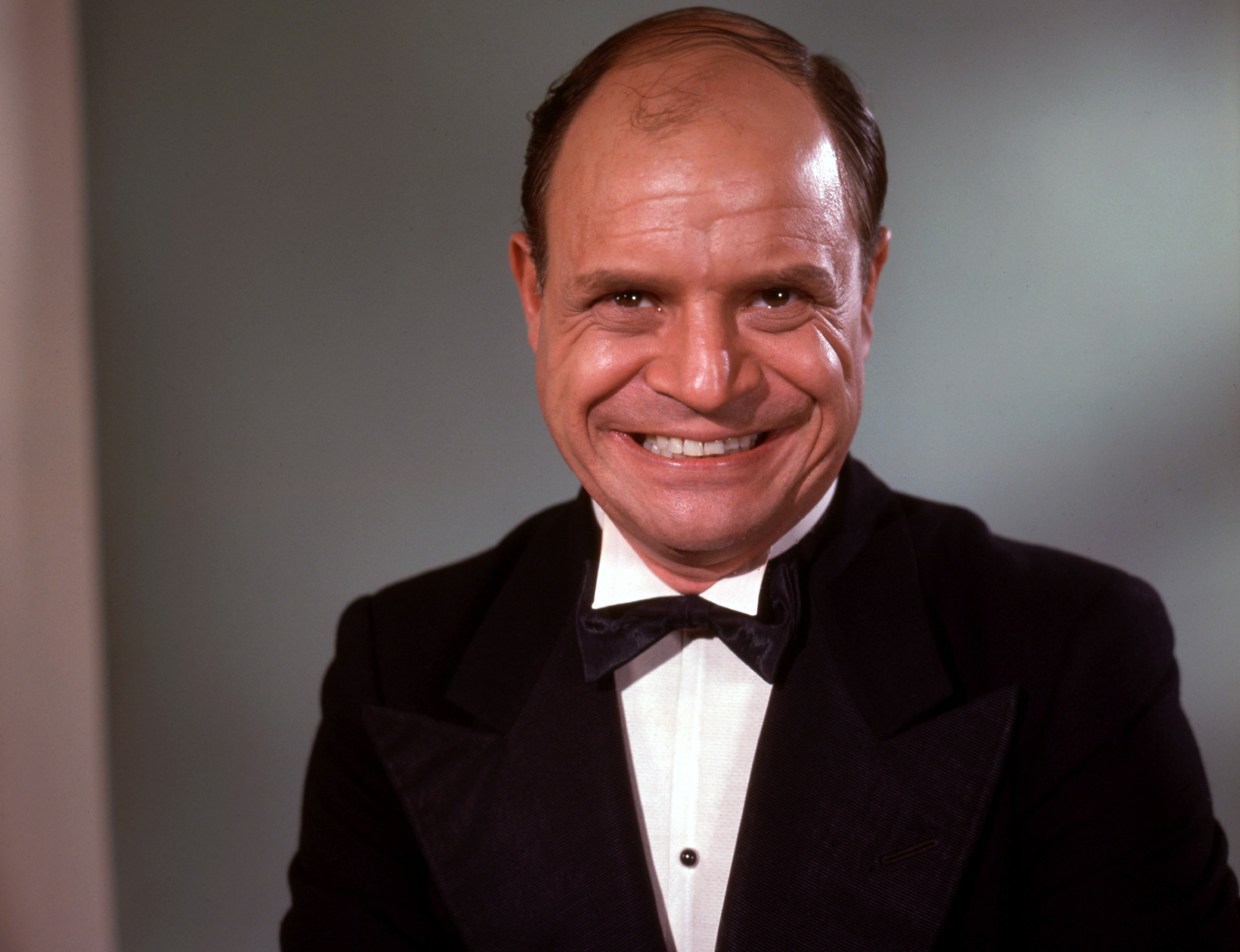 Don Rickles in suit looking at front