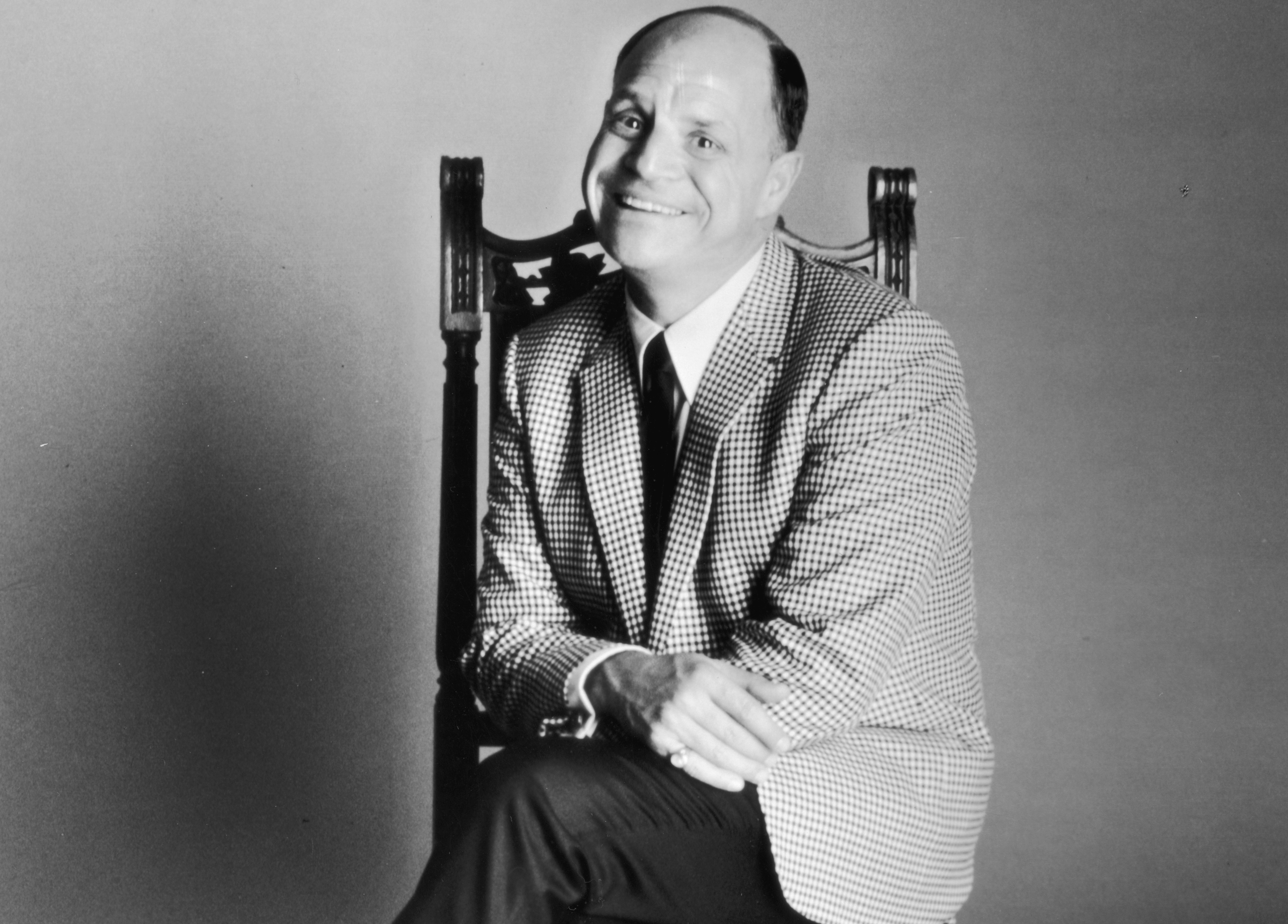 Don Rickles, sitting in a chair