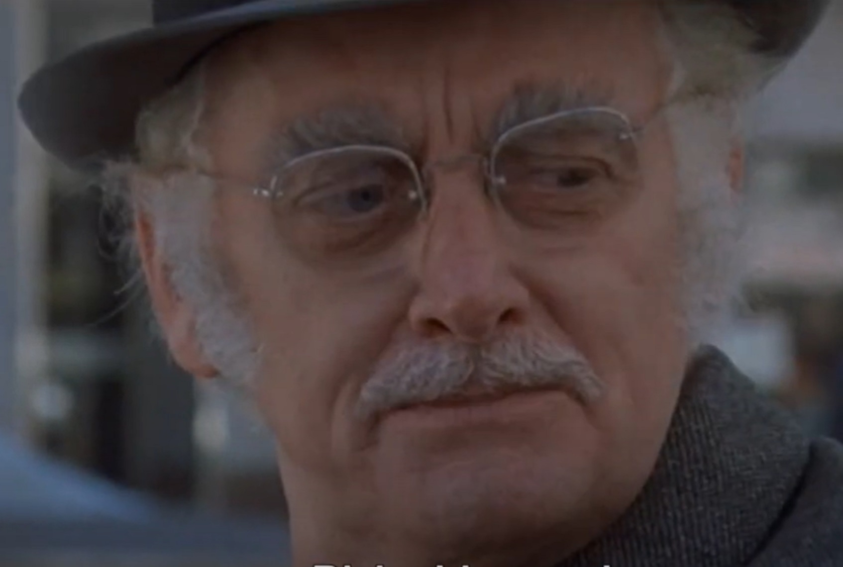 Screenshot of Art Carney wearing glasses and hat is looking at side - from Harry and Tonto (1974)