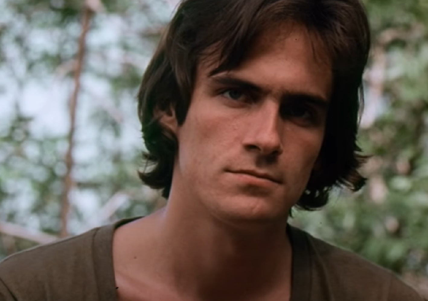 Screenshot of James Taylor looking at camera - from Two-Lane Blacktop (1971)