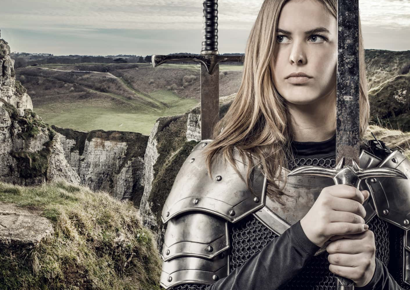 Sword wielding blond female Viking warrior.