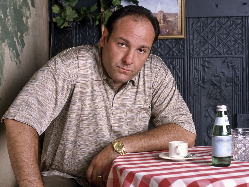 James Gandolfini sitting at a table