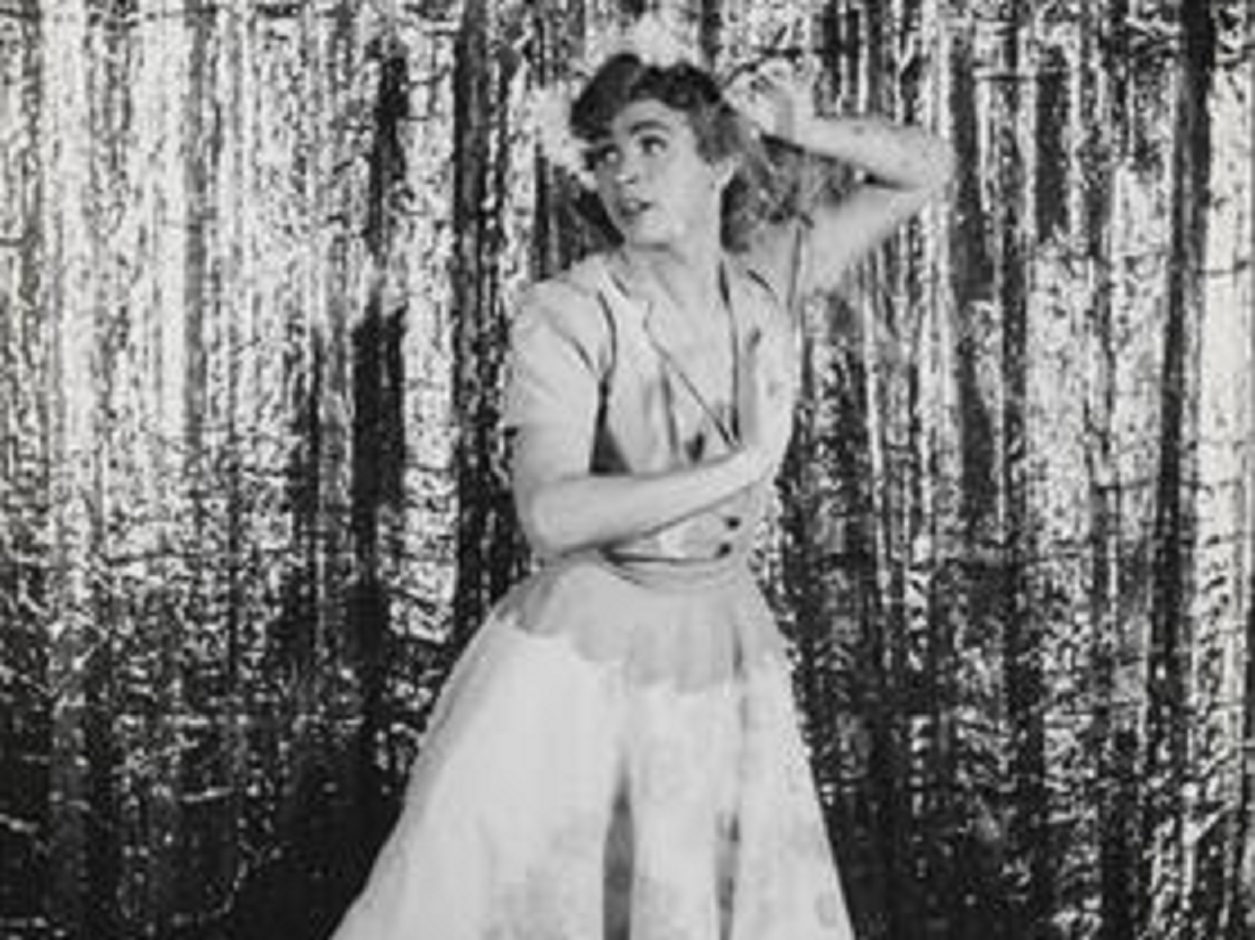 B&W photo of Nelson Barclift dancing in dress.