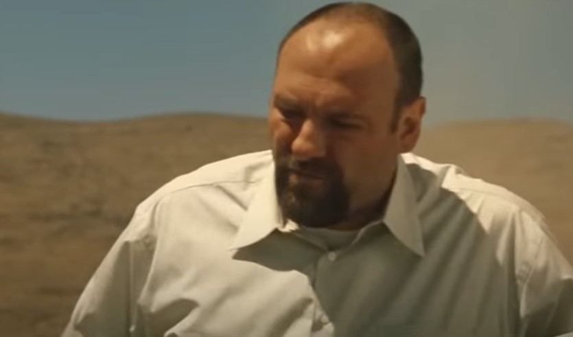 James Gandolfini as Leroy, in desert wearing white shirt