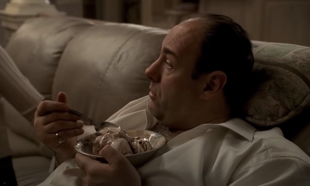 James Gandolfini as Tony Soprano sitting in armchair