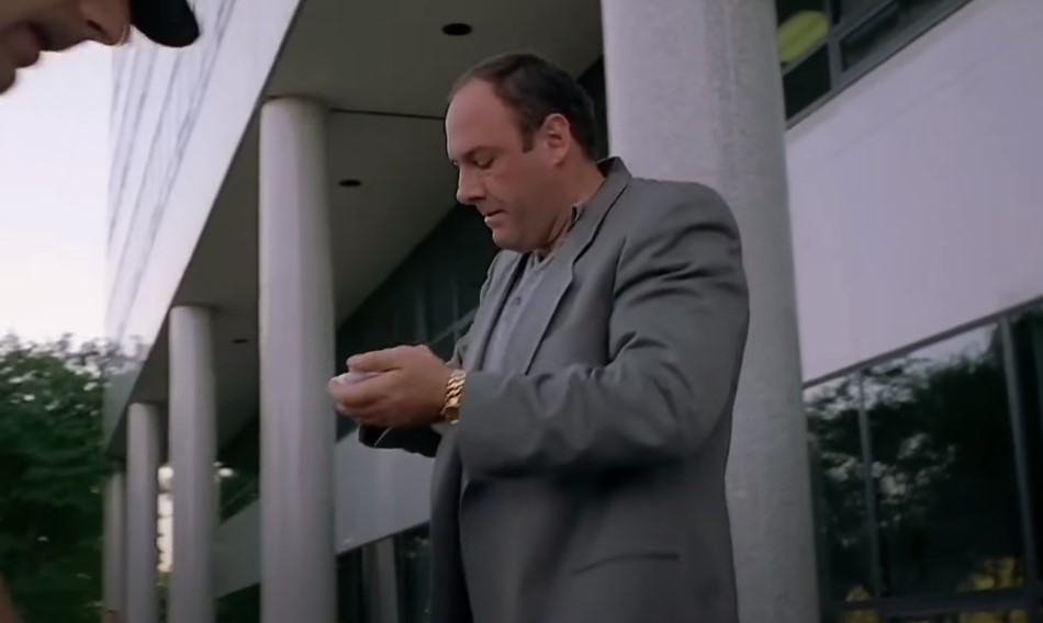 James Gandolfini as Tony Soprano in gray suit and a golden watch
