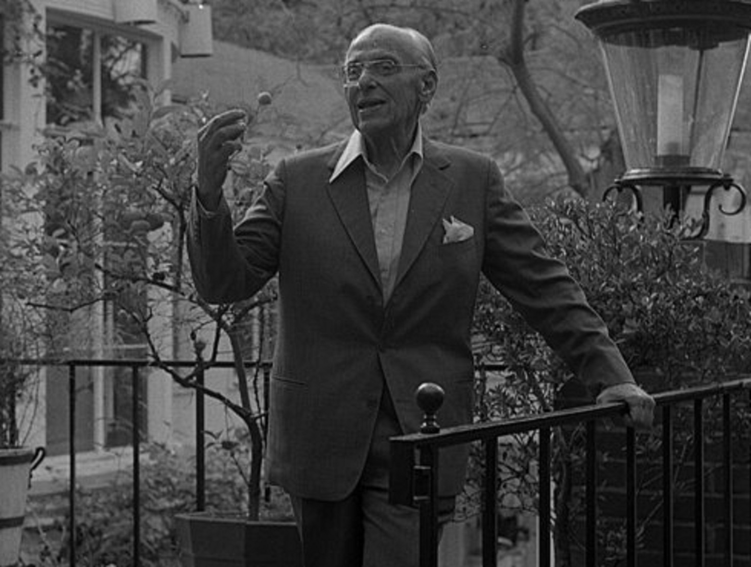 Director George Cukor, full length portrait on garden terrace - 1978