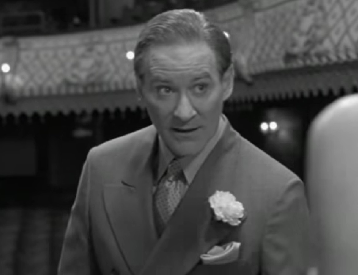 Screenshot of Cole Porter (Kevin Kline) wearing suit is looking upset from - De-Lovely (2004)