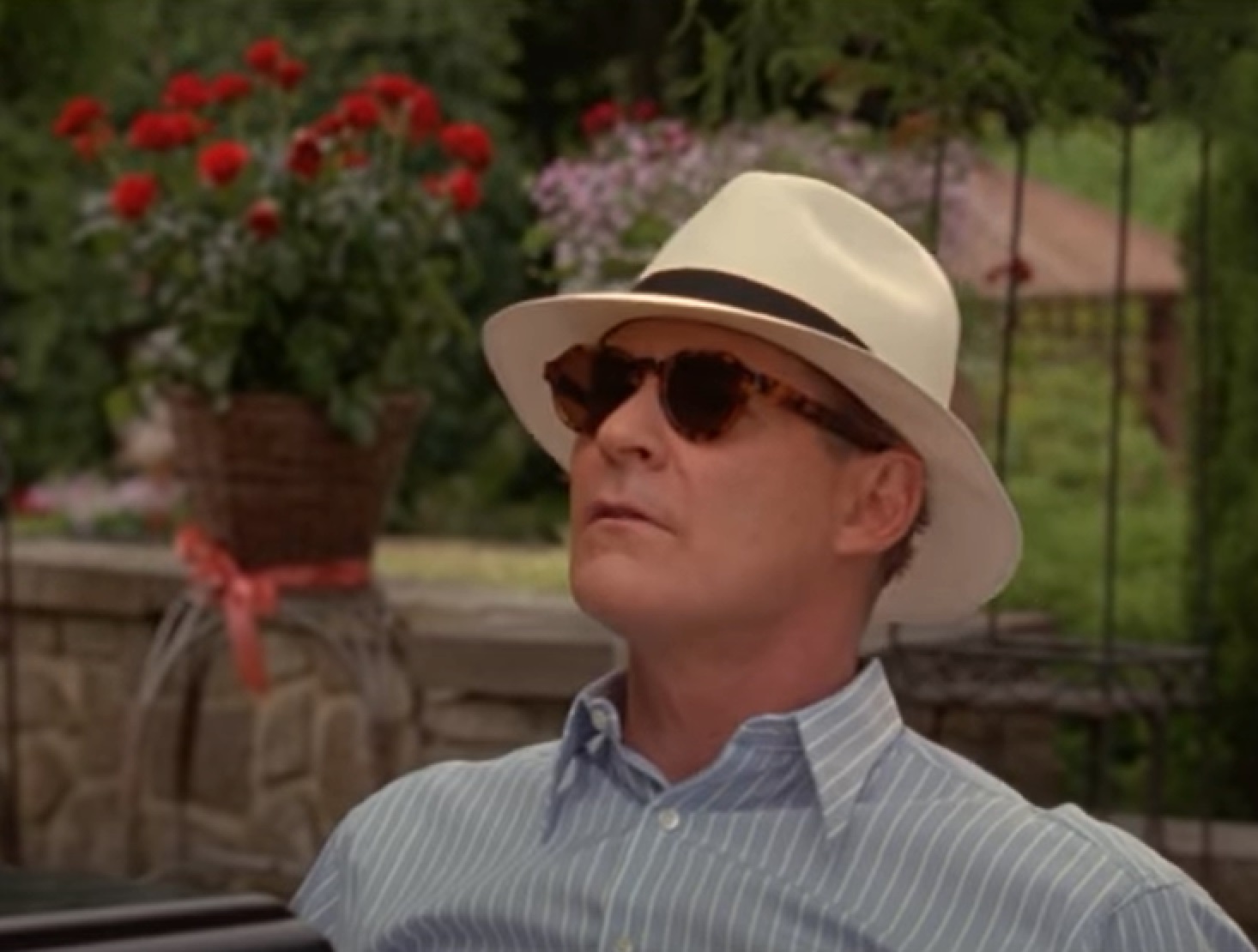 Screenshot of Cole Porter (Kevin Kline) wearing shirt and white hat with glasses is looking up from - De-Lovely (2004)