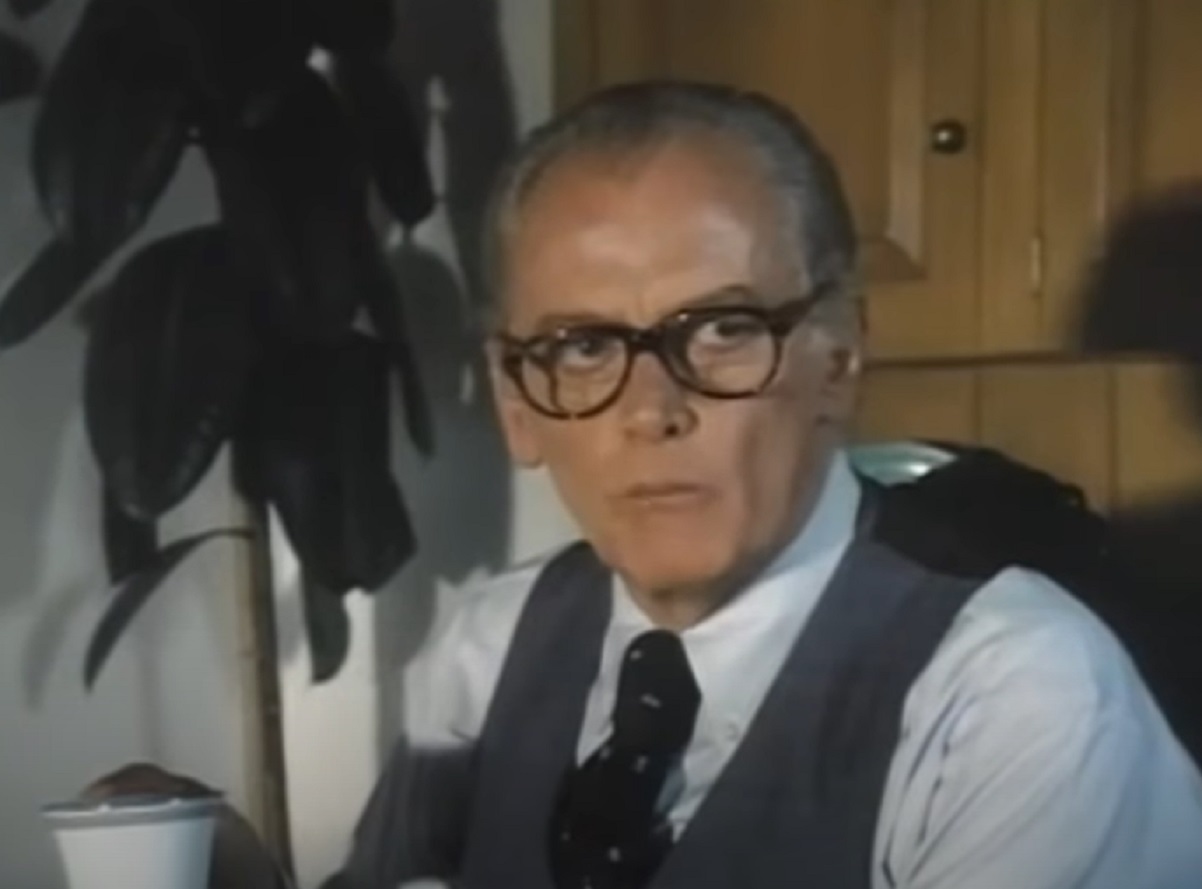 Screenshot of Art Carney wearing white shirt and glasses looking at side - from Katherine (1975)