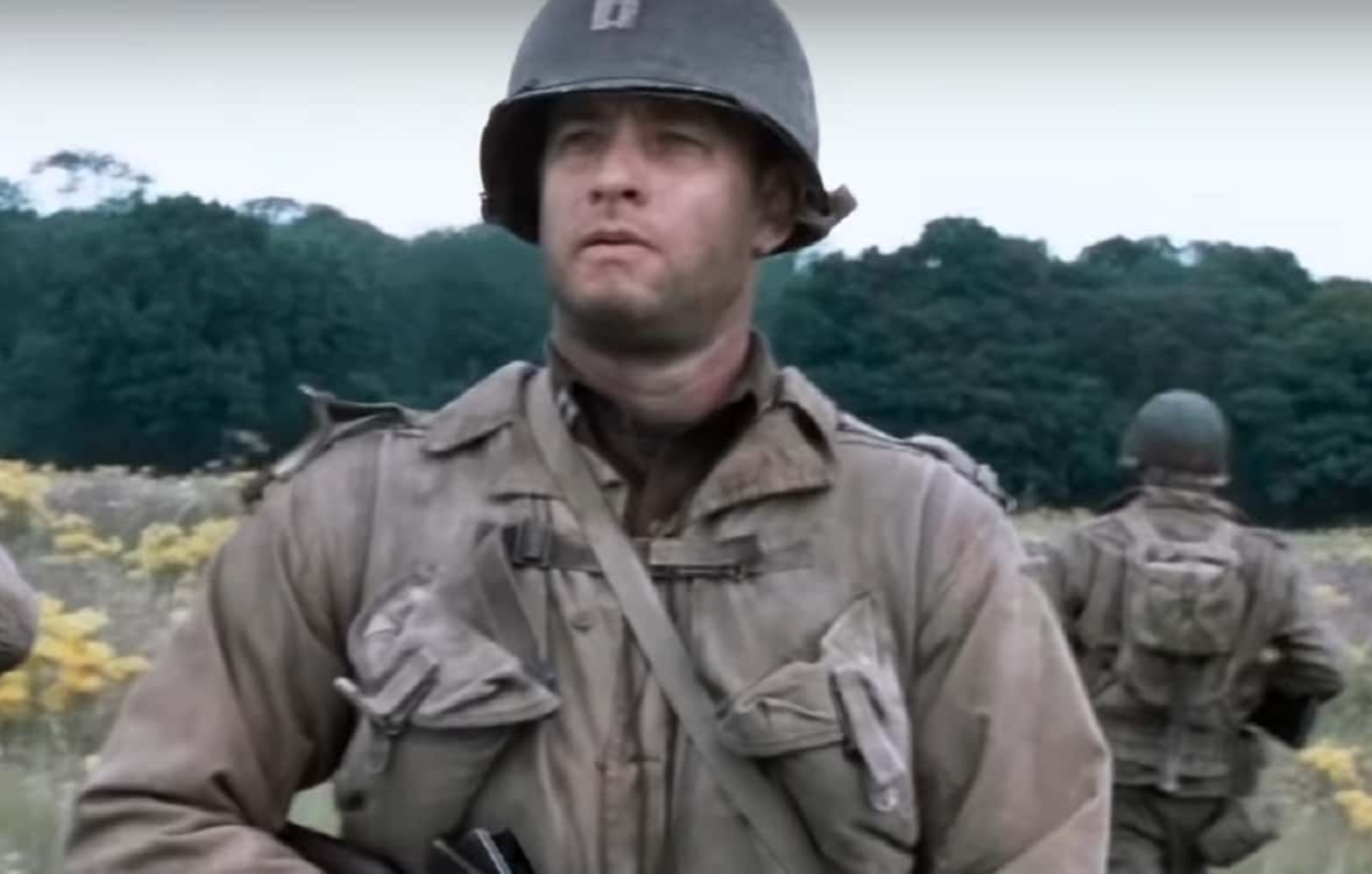 Screenshot of (Tom Hanks) Captain Miller looking at side outside - from Saving Private Ryan (1998)
