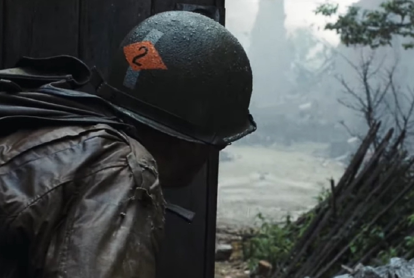 Screenshot of (Tom Hanks) Captain Miller looking at empty street - from Saving Private Ryan (1998)