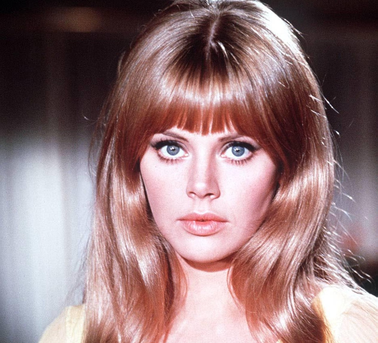 Britt Ekland in yellow top