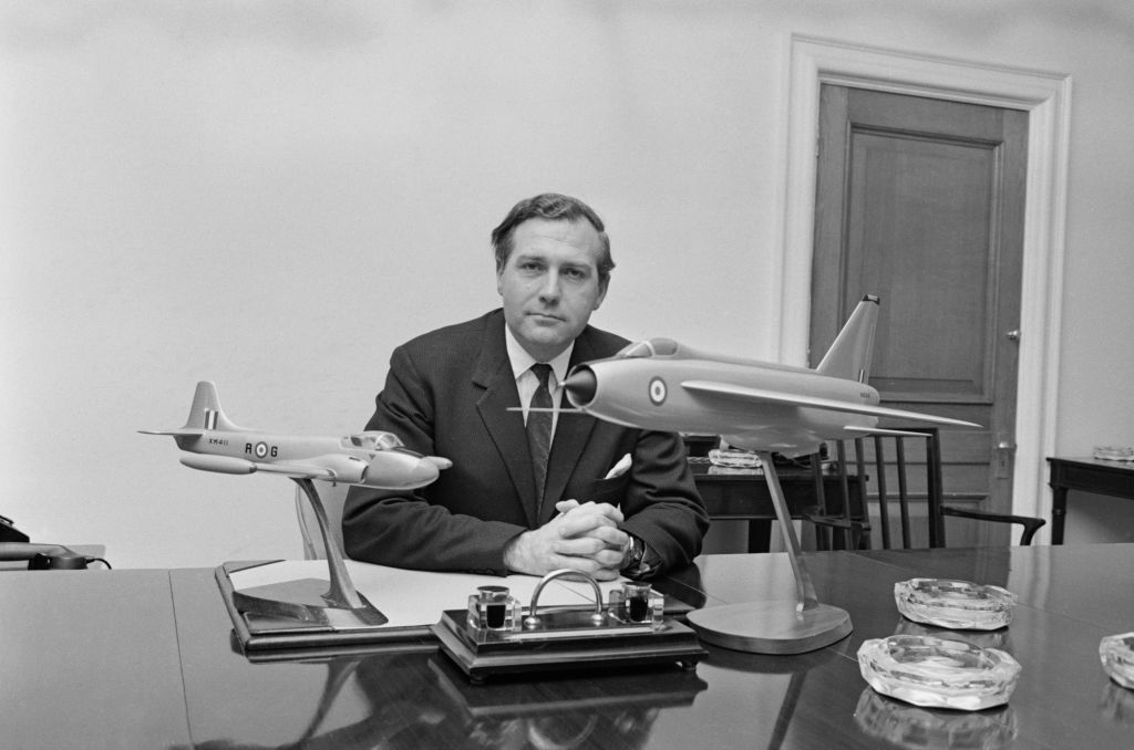 John Stonehouse sitting at his desk