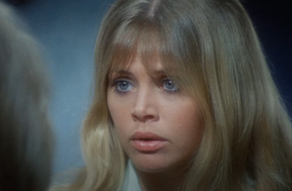 Britt Ekland in  Asylum movie looking at someone