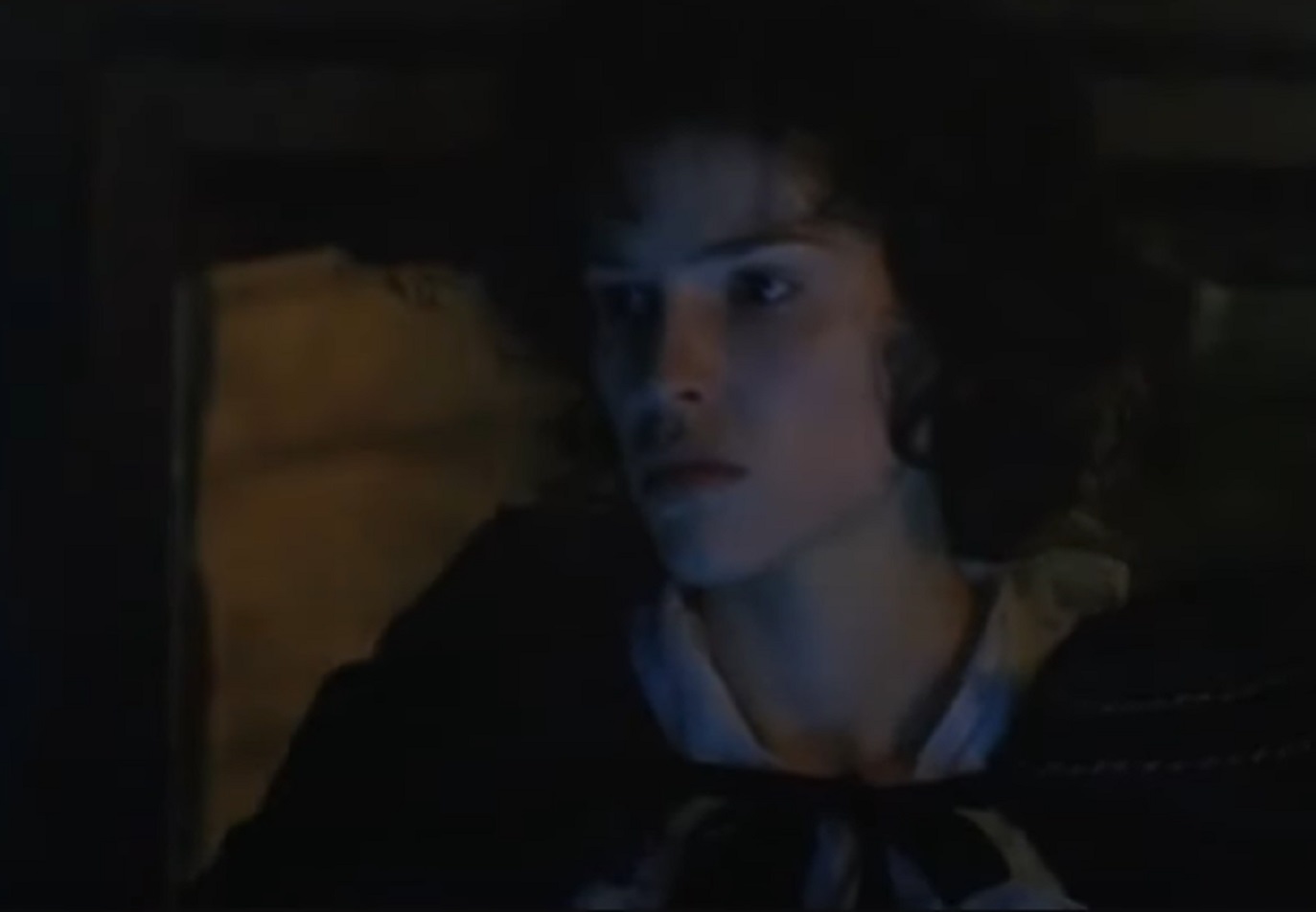 Screenshot: Jeanne St. Remy de Valois in black coat is looking ta the dark - from The Affair of the Necklace (2001)