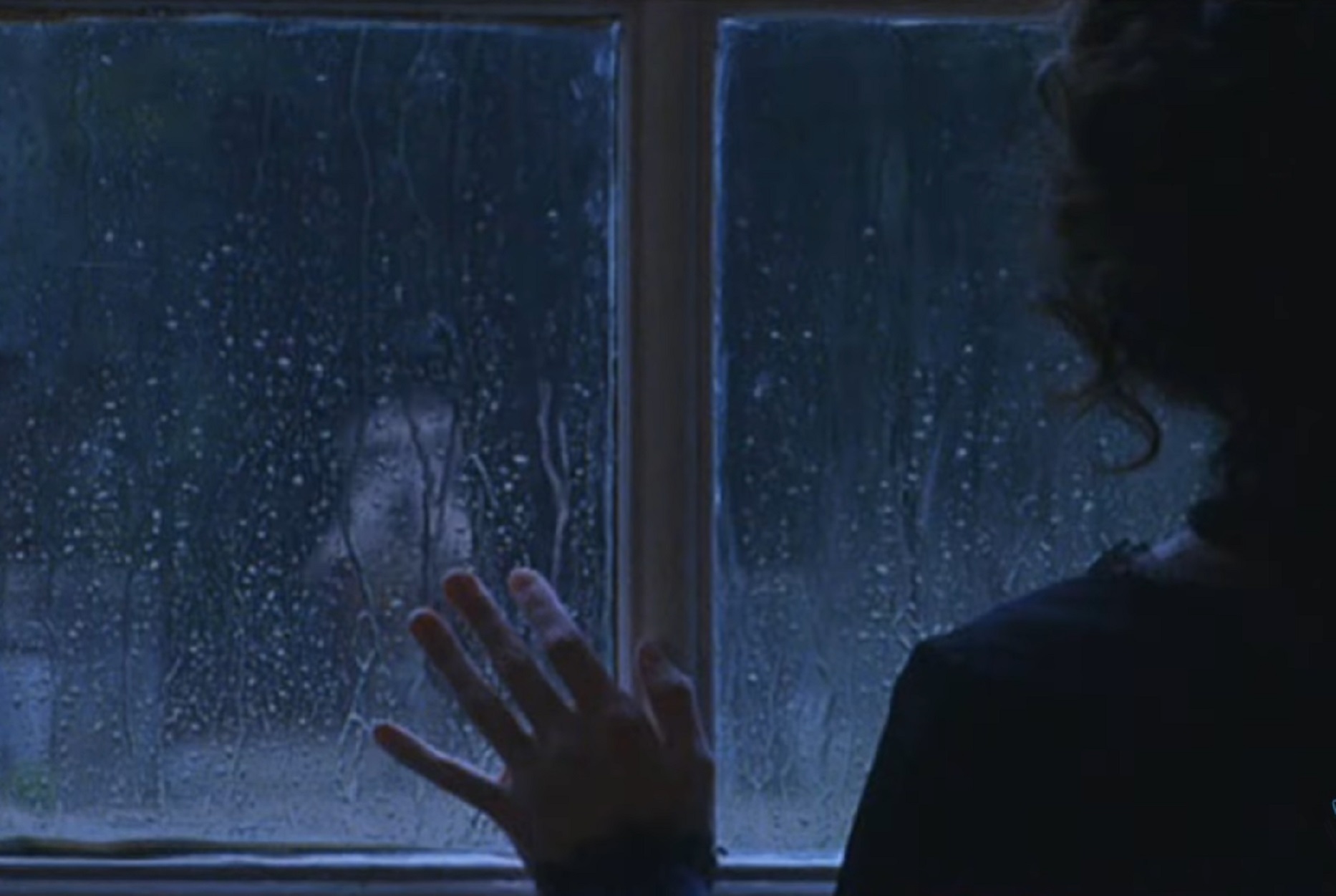 Screenshot: Jeanne St. Remy de Valois in dark is looking from window - from The Affair of the Necklace (2001)