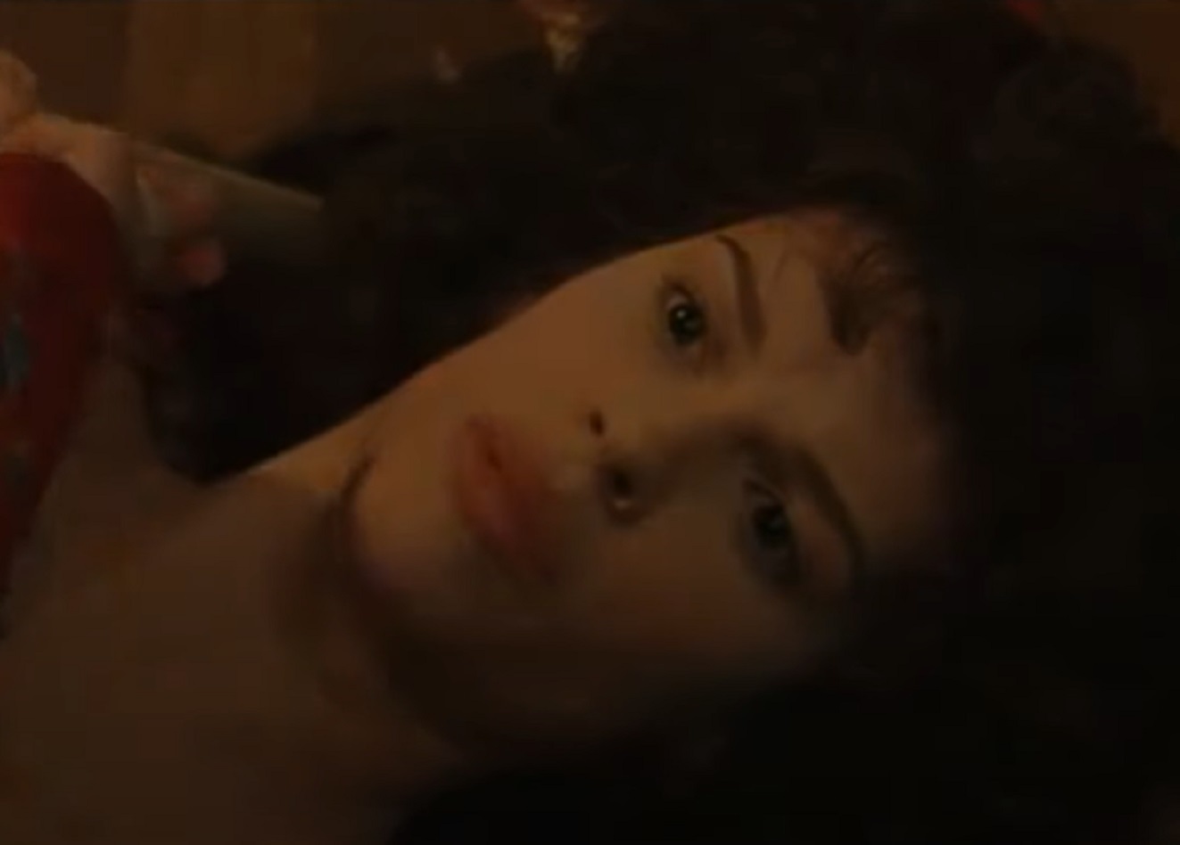 Screenshot: Jeanne St. Remy de Valois laying on the bed  - from The Affair of the Necklace (2001)