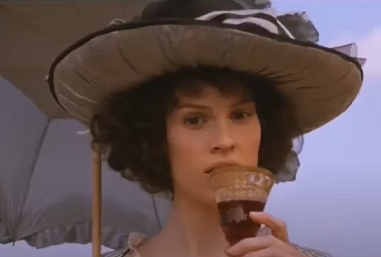 Screenshot: Jeanne St. Remy de Valois wearing white dress and hat is looking outside - from The Affair of the Necklace (2001)