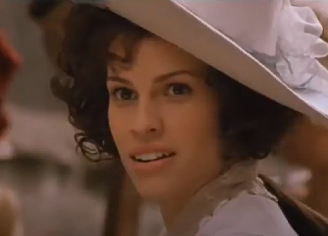 Screenshot: Jeanne St. Remy de Valois wearing white dress and hat is looking at front - from The Affair of the Necklace (2001)