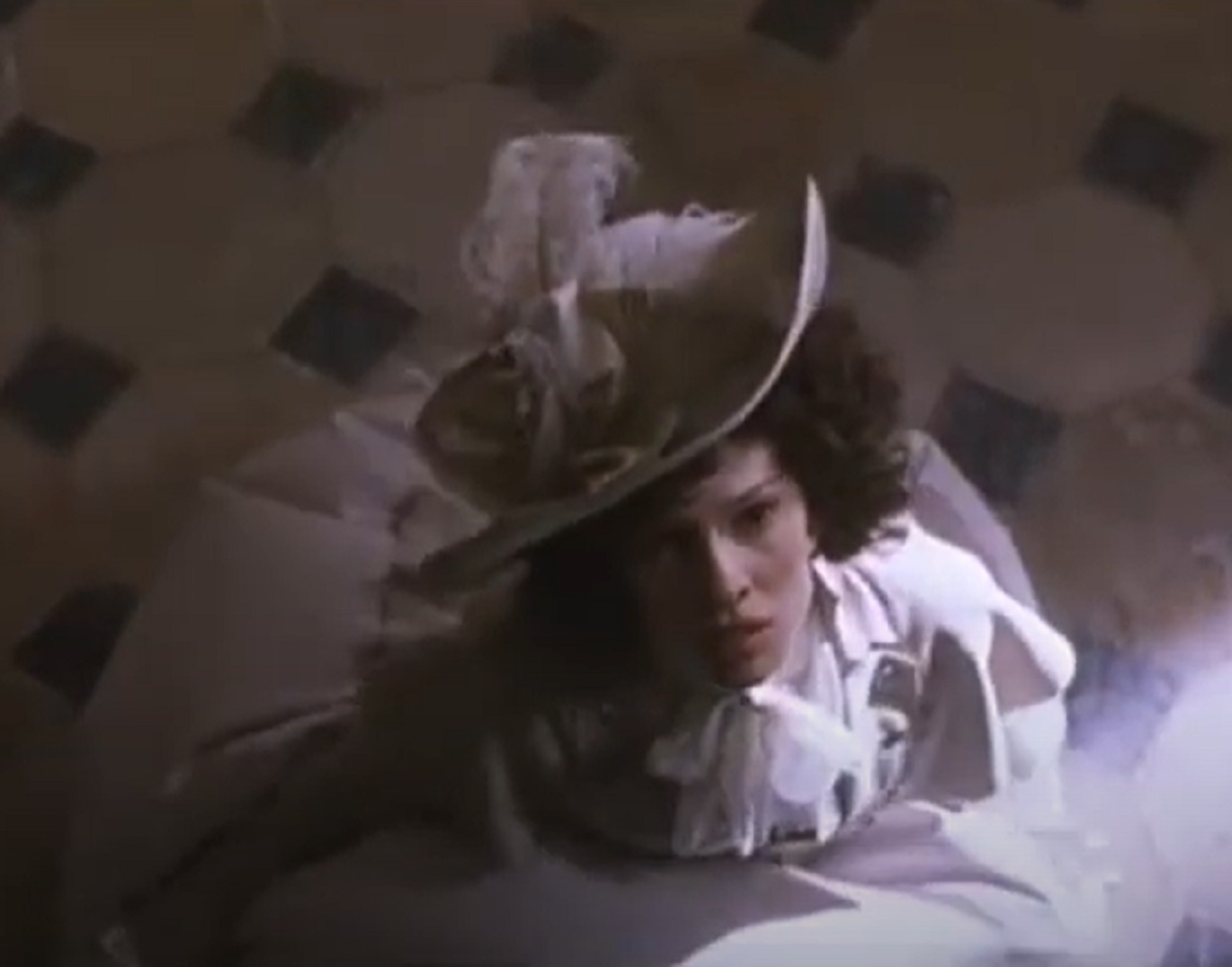 Screenshot: Jeanne St. Remy de Valois wearing white dress and hat is looking up - from The Affair of the Necklace (2001)