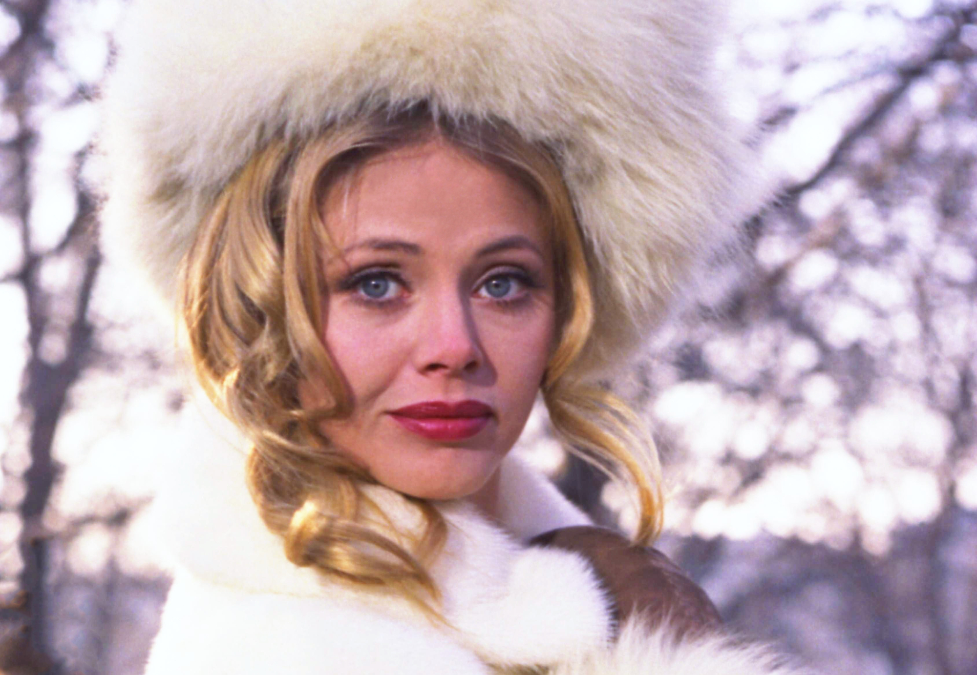 Britt Ekland in white coat