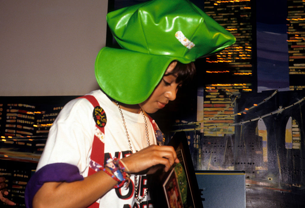 Lisa 'Left Eye' Lopes in white and big green hat