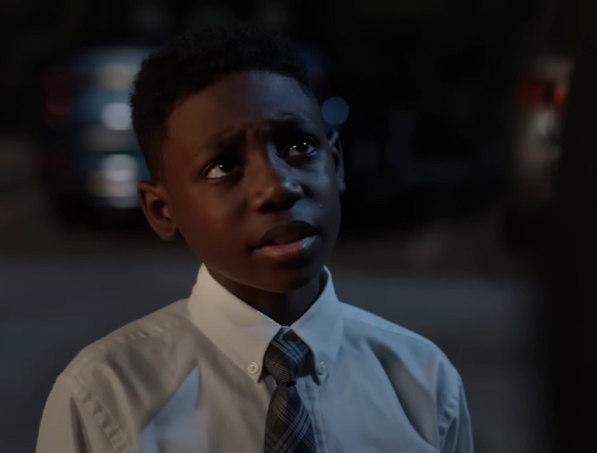 Screenshot of Liam Gallagher in white shirt is looking up - from Shameless (2011-21)