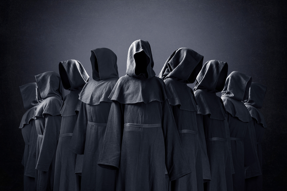 People from a cult in black robes