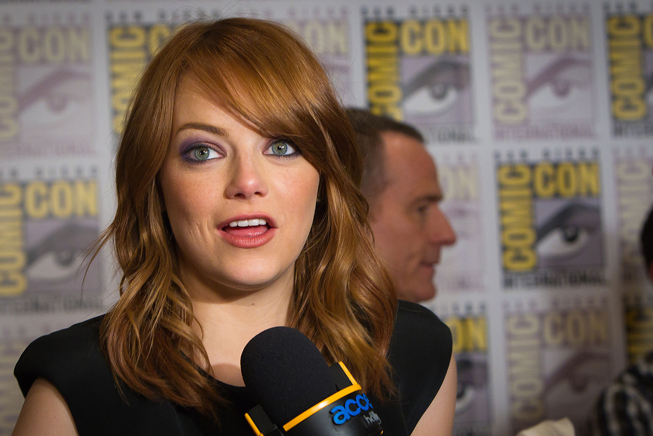 Emma Stone talking on the microphone - 2011.