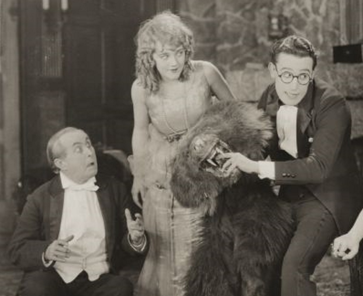 Mildred Davis, Harold Lloyd in a scene still for the American comedy film Among Those Present (1921).