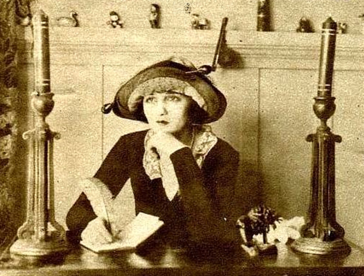 Actress Bebe Daniels wearing dress and hat in her suite at a converted house on the Realart Studio lot in Hollywood - 1921