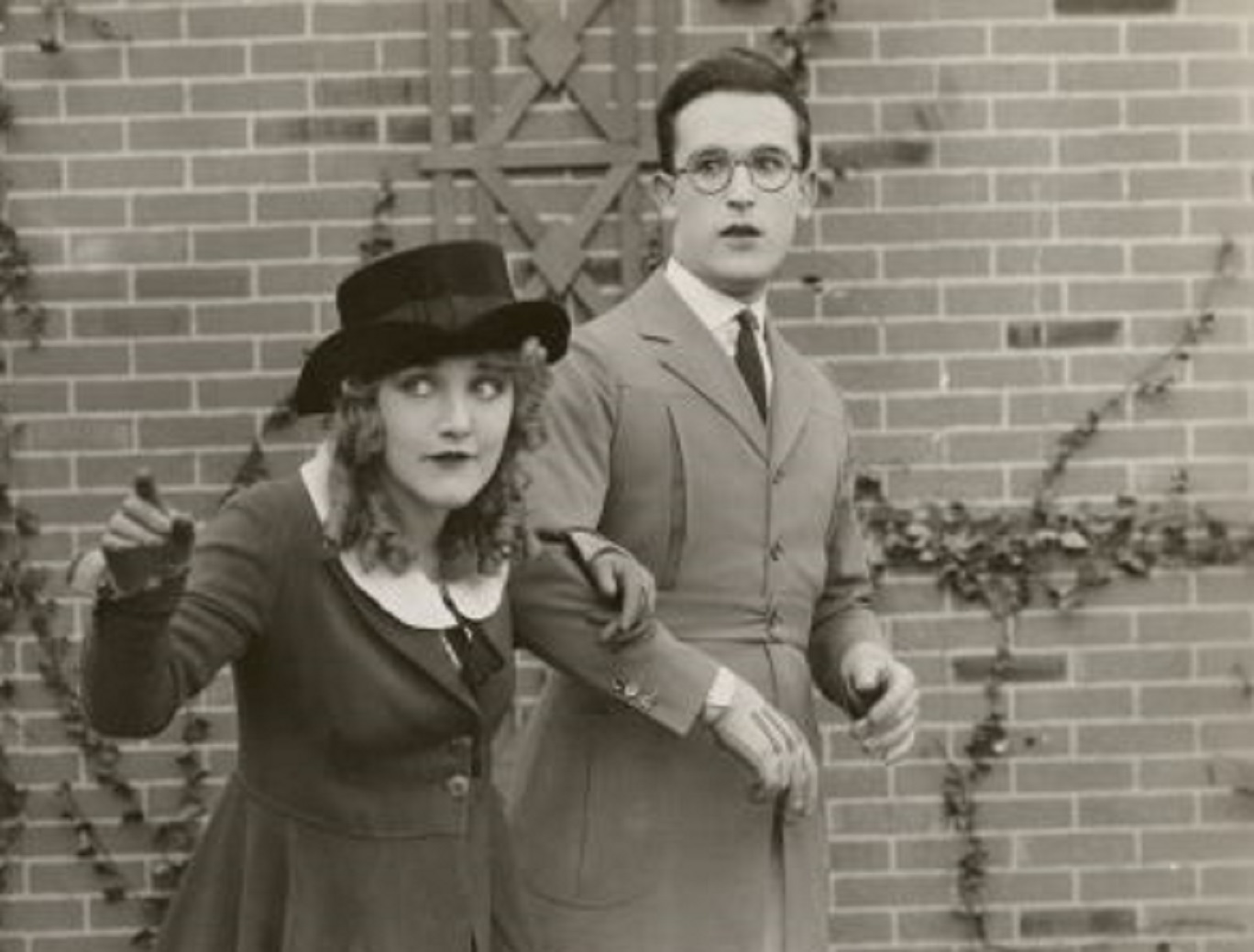 Mildred Davis and Harold Lloyd in a scene still for the 1921 silent comedy Among Those Present.- 1921