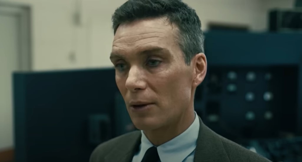Cillian Murphy as Robert Oppenheimer in suit and  hat