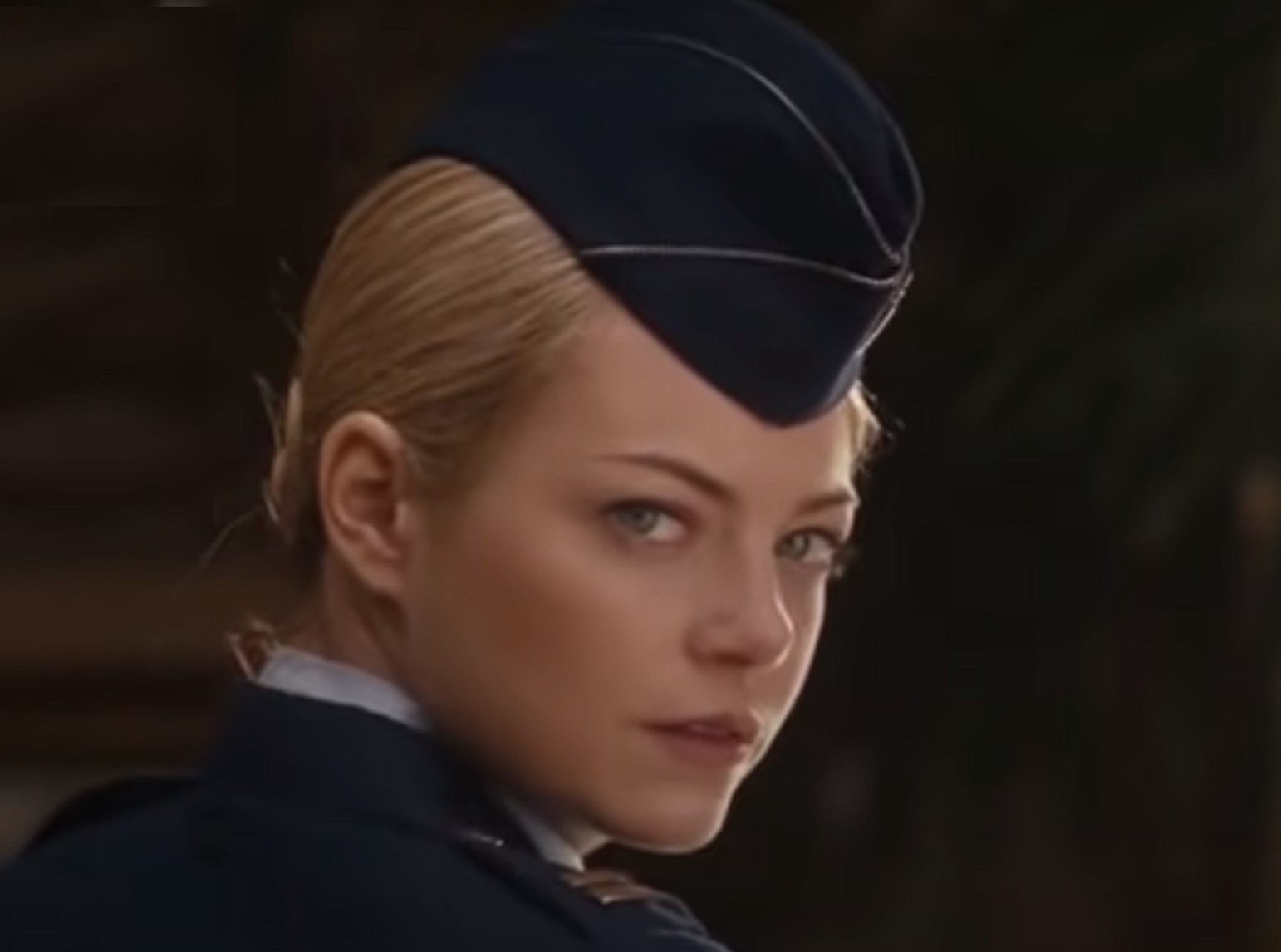Screenshot : Emma Stone wearing navy uniform and looking at camera - from Aloha (2015)