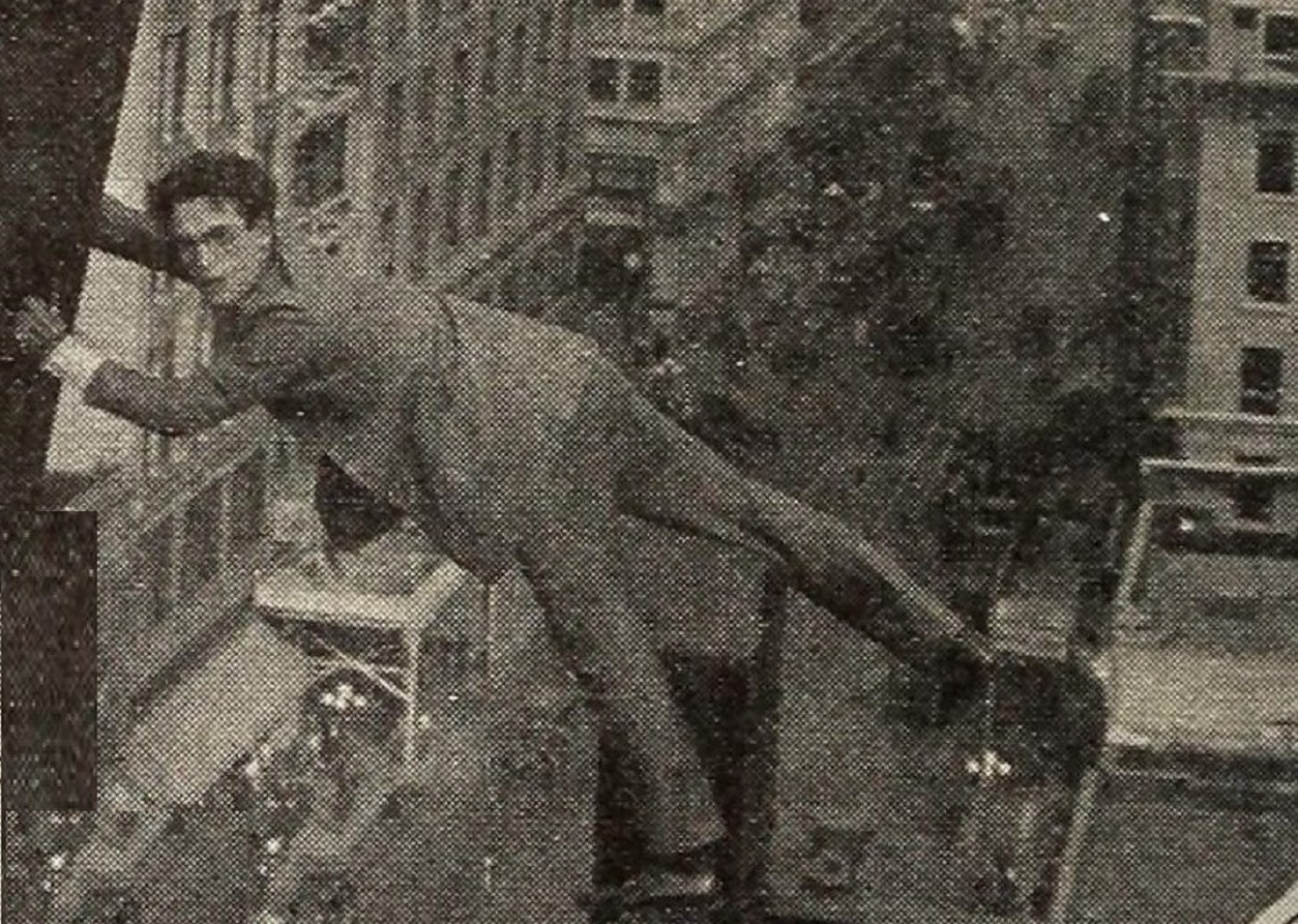 Harold Lloyd in grey suit in Never Weaken, Exhibitor's Trade Review, October 8, 1921.