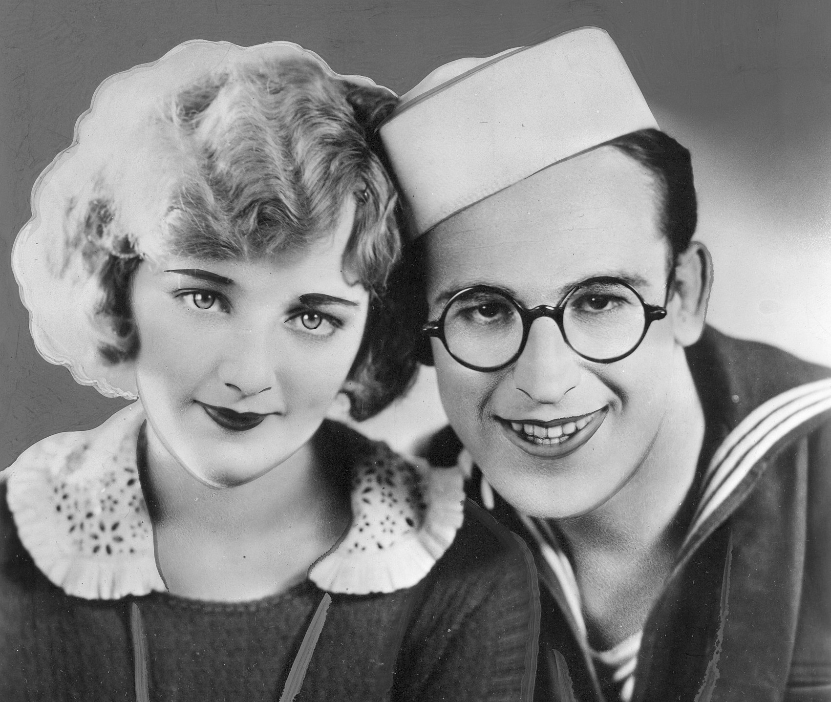 Comedian Harold Lloyd in navy suit and Mildred Davis in black and white sweater - from A Sailor-Made Man -1920
