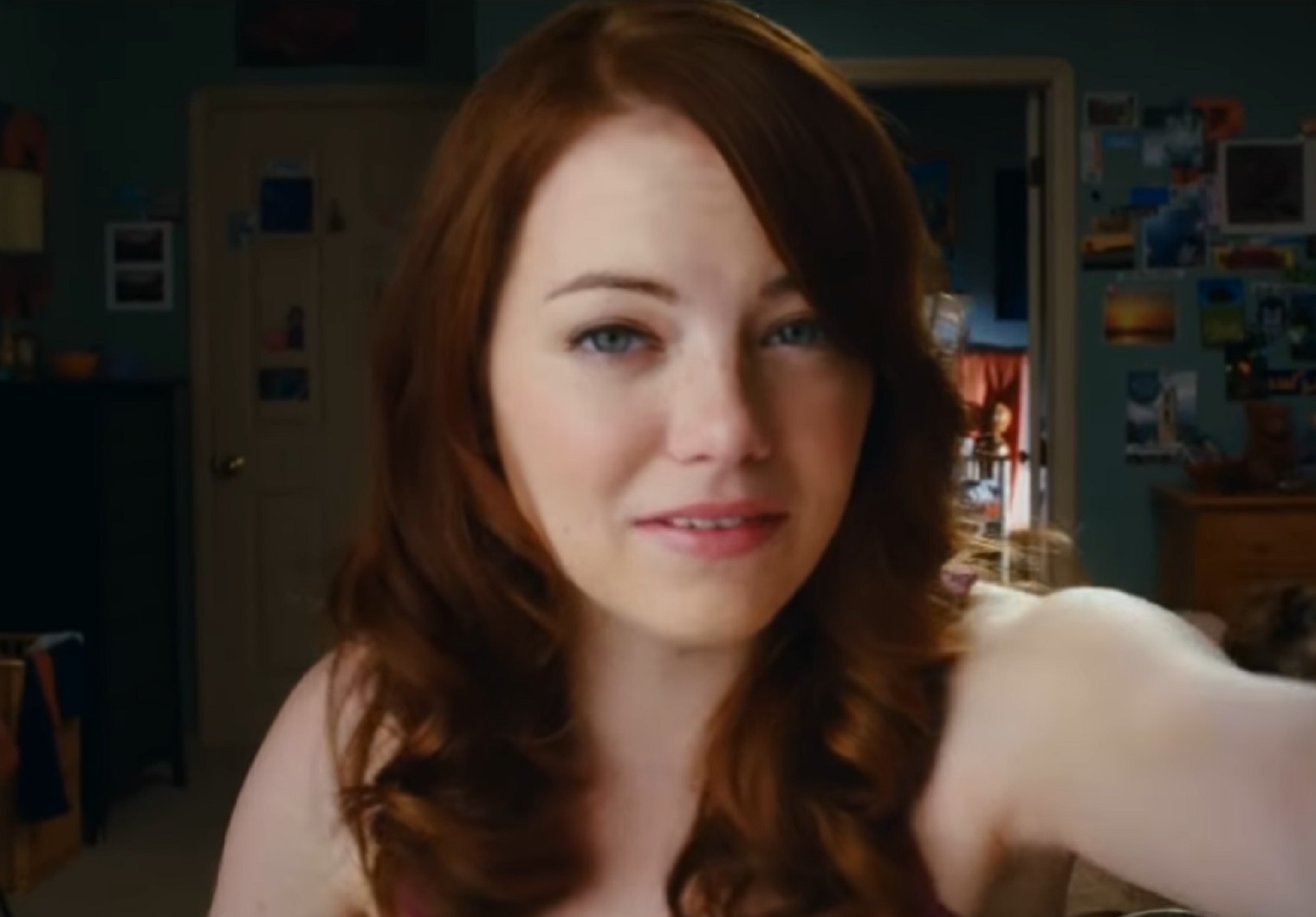 Screenshot: Emma Stone with brown hair looking at web camera - from Easy A (2010)