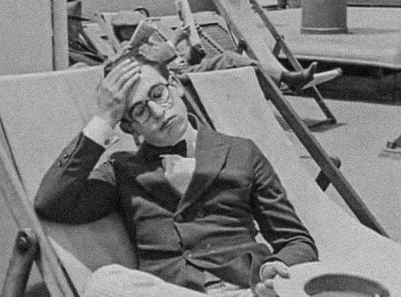 Screenshot B&W - Harold Lloyd wearing black suit, looking sad - from Captain Kidd's Kids (1919)