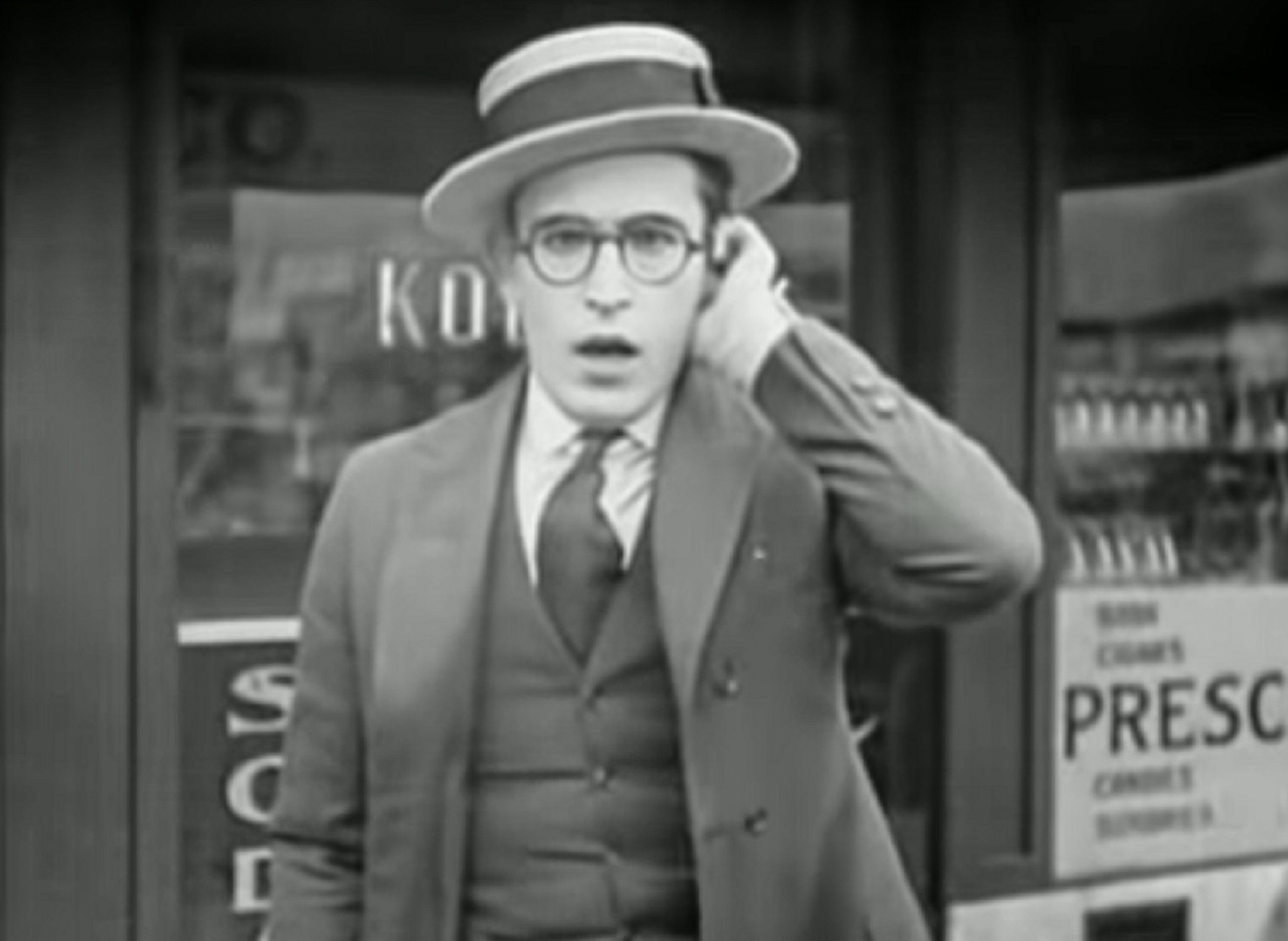 Screenshot B&W - Harold Lloyd looking surprised on the street - from Number Please (1920)