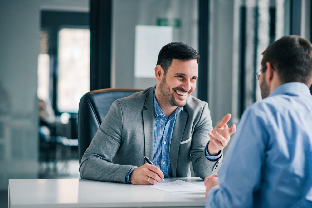 Man having a business meeting with his boss at the boss's office