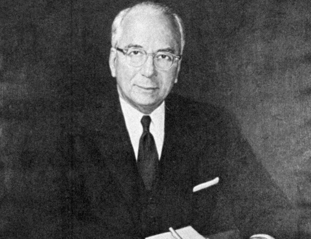 Lewis Lichtenstein Strauss sitting and signing papers