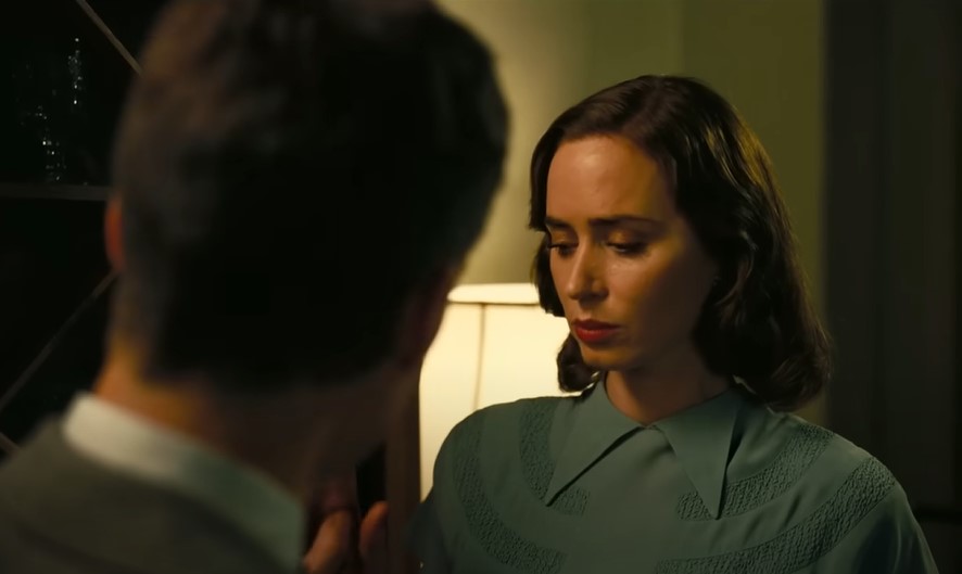 Emily Blunt as Kitty Oppenheimer in green top talking to Cillian Murphy as Robert Oppenheimer