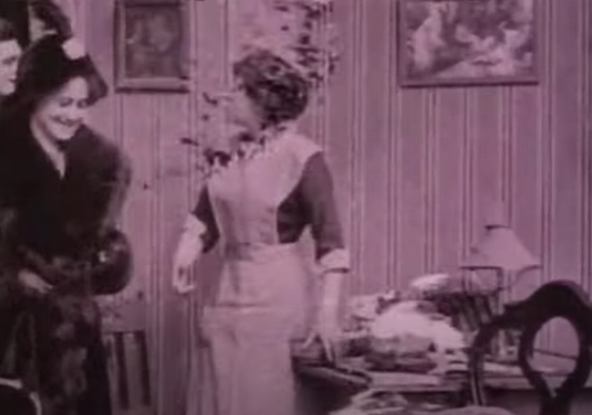 Dorothy Gibson getting in a room