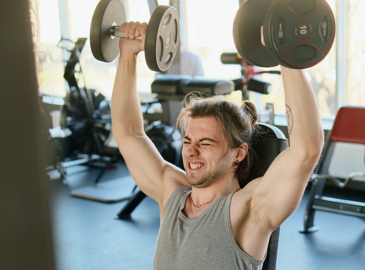 Man exercising at gym.
