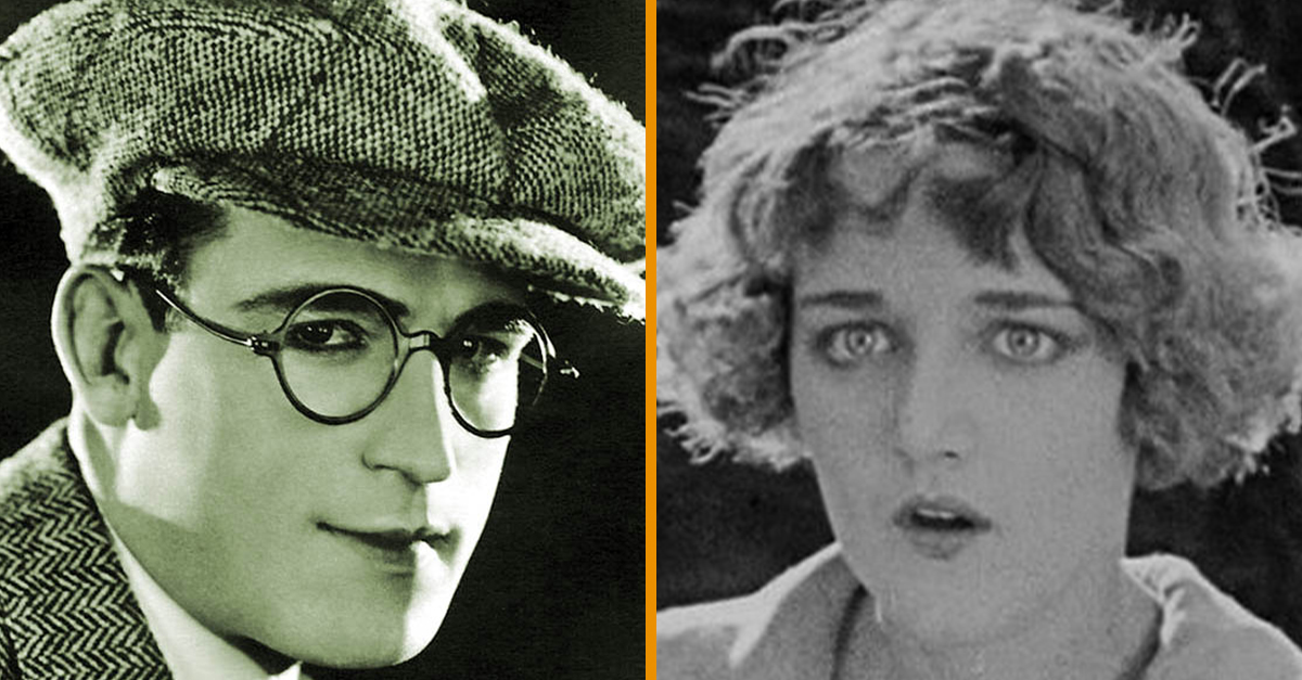 Harold Lloyd in a daring stunt, suspended from a clock tower