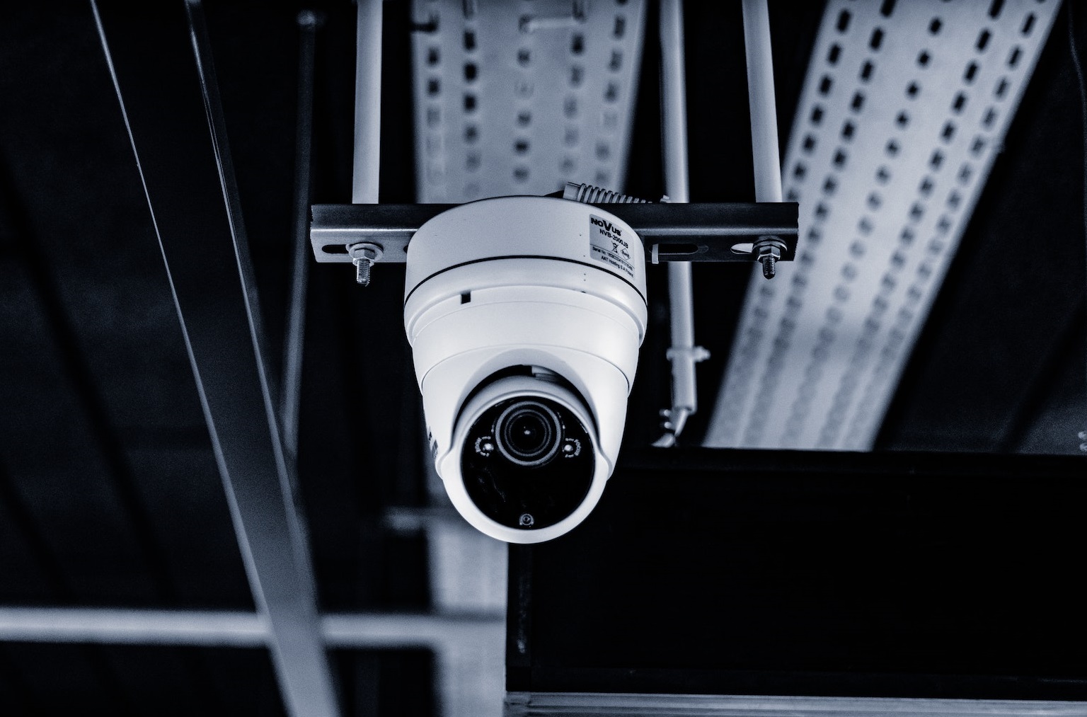 A white cctv camera recording.