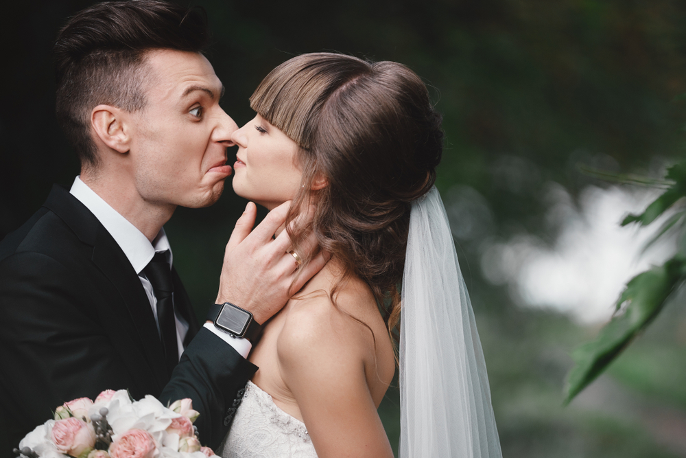 Angry bride and groom looking at each other
